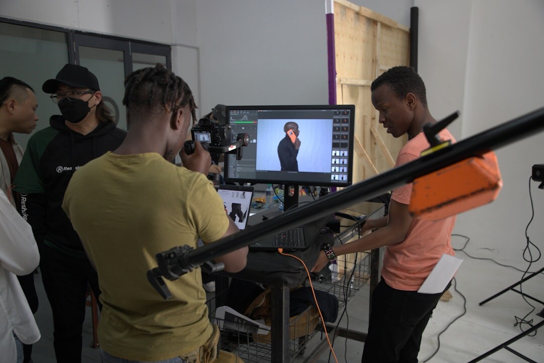 Visual composition training session with participants reviewing shots on large monitor