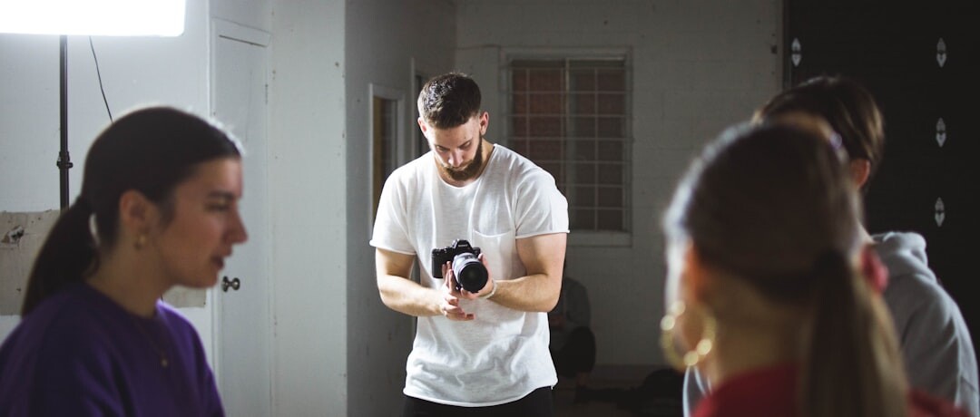 Camera framing lesson with instructor demonstrating professional shot composition