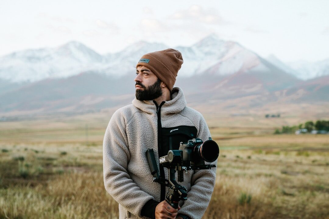 Journalist carefully checking camera framing on a professional news shoot outdoors