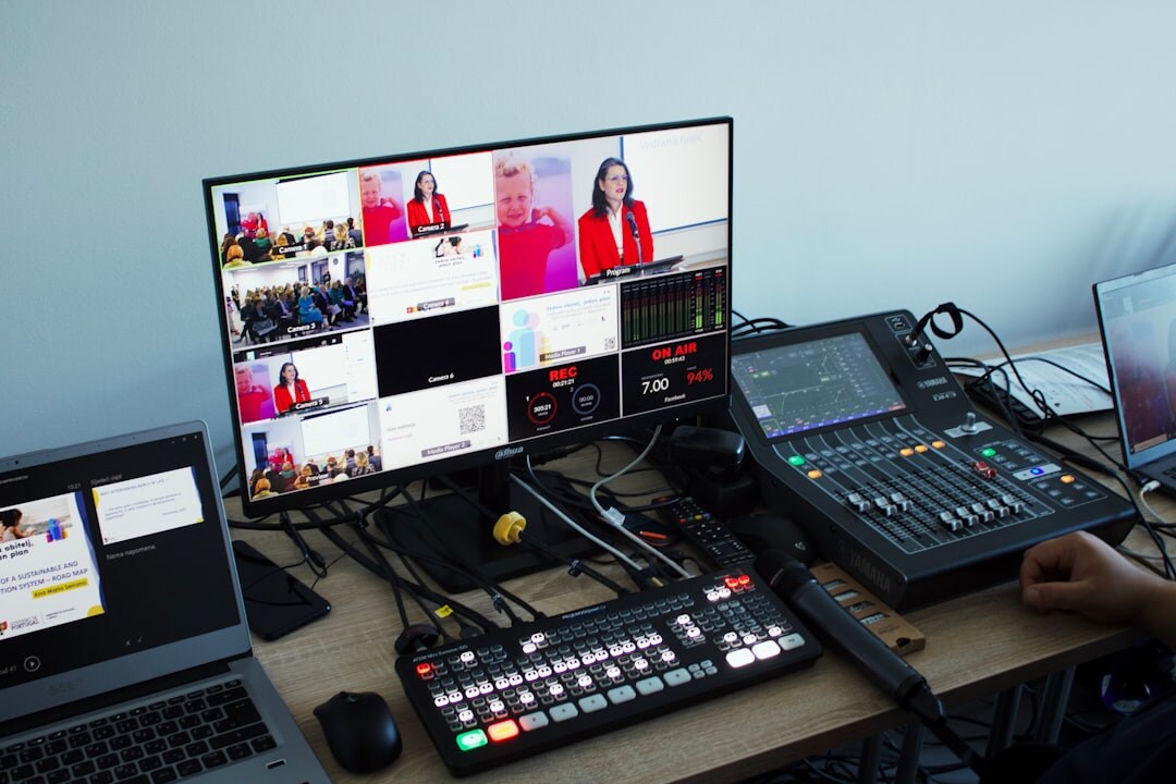 Broadcast control room with multiple monitors and production operators
