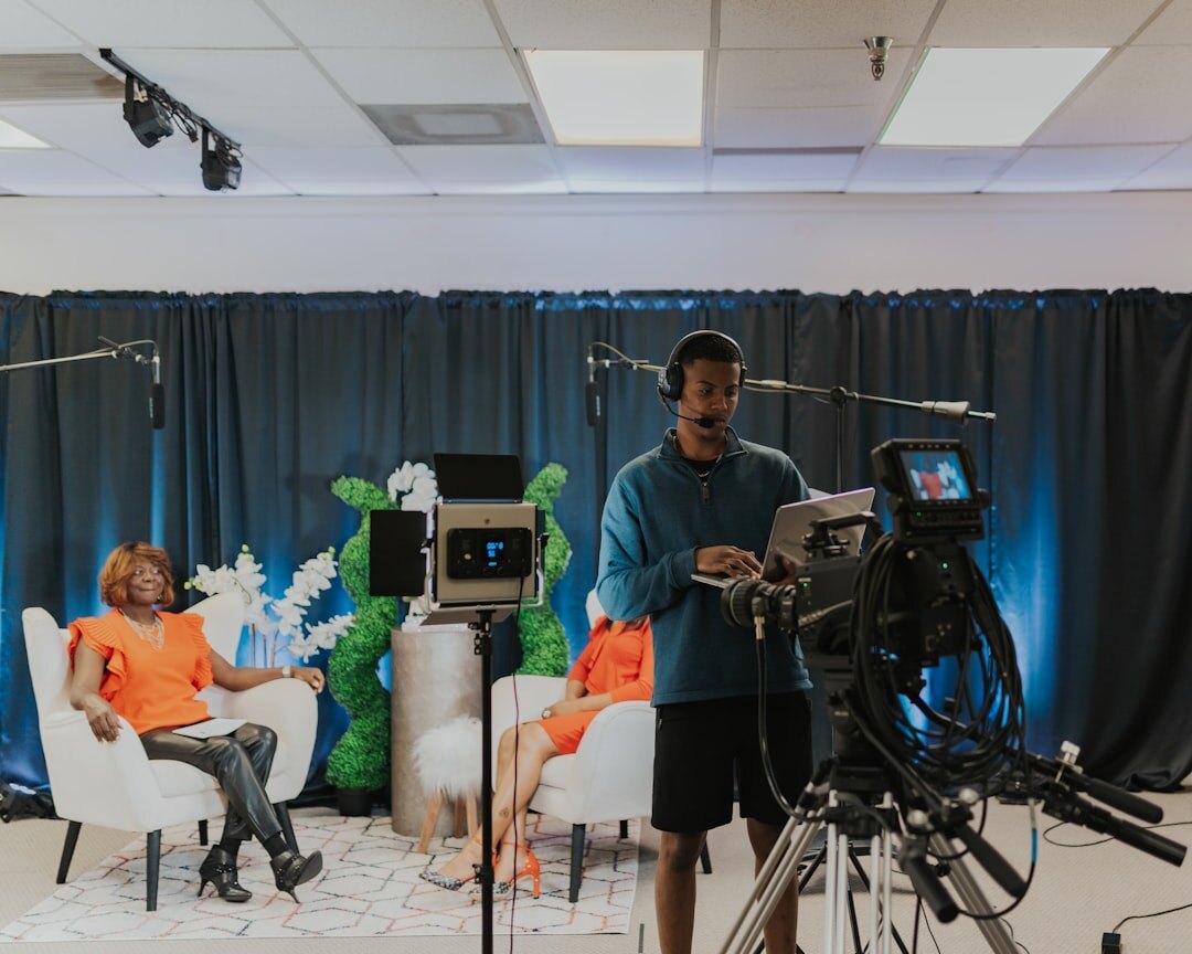 On-camera coaching session with presenter reviewing performance playback